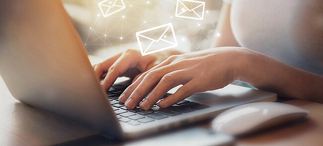 
			Hands typing on a laptop keyboard